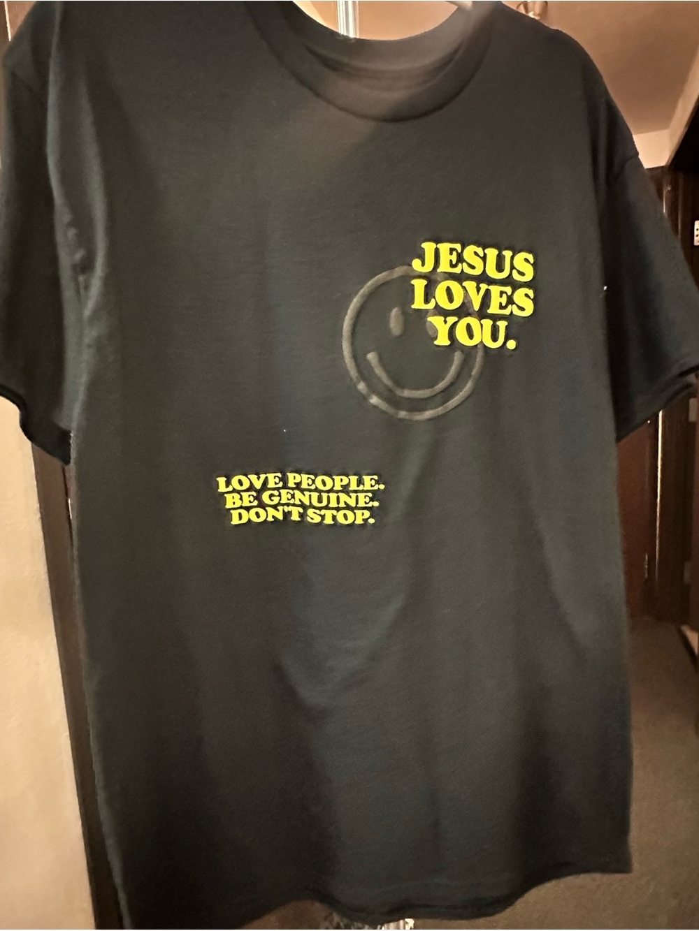 Black Graphic Tee with Yellow 'Jesus Loves You' Print